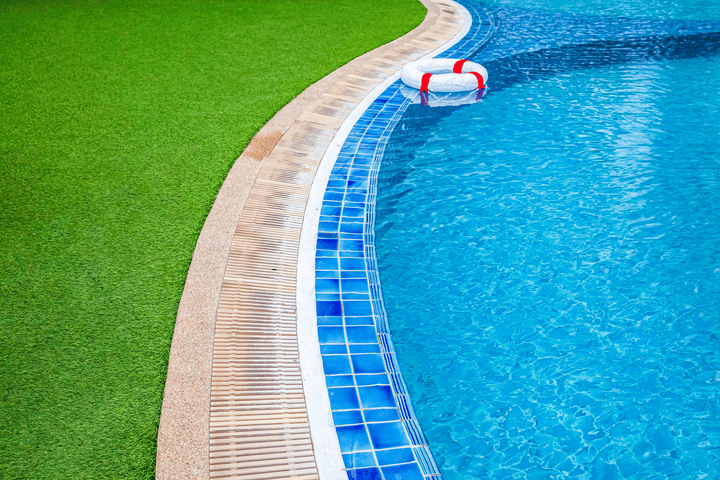 Poolside area with UV-resistant artificial grass